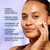 Model posing applying Olay Super Cream Mini with Sunscreen SPF 30, Ultra Lightweight SPF Face Moisturizer to face. Visibly reduces dark spots. Primes skin for makeup. hydrates up to 24 hours. Protects against sun damage. leaves a radiant dewy glow.