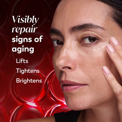 Model posing using Regenerist Eye Wrinkle Correcting Treatment on face. Visibly repair signs of aging. Lifts tightens brightens
