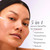 Model applying serum to face with dropper. 5 in 1 serum benefits to improve hydration, smoothness, firmness, brightness, texture.