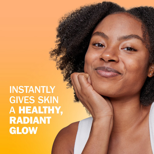 Model posing. Instantly gives skin a healthy, radiant glow.