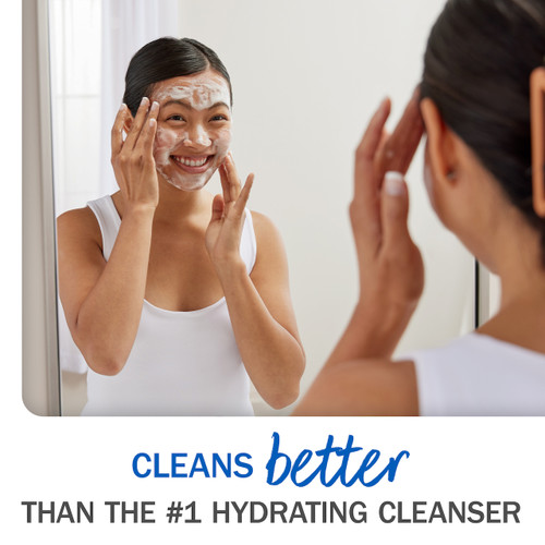Cleans better than the #1 hydrating cleanser. Model applying Melts cleanser to face.
