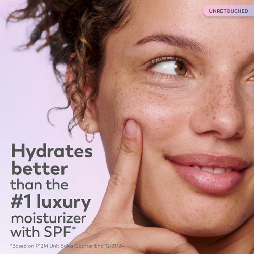 Model posing. Hydrated better than the #1 luxury moisturizer with SPF.* *based on P12M unit sales quarter end 12/31/24