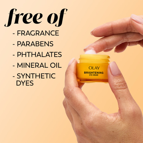 Model dabbing fingers in Olay Brightening Eyes Vitamin C Eye Cream. Free of fragrance, parabens, phthalates, mineral oil, synthetic dyes.