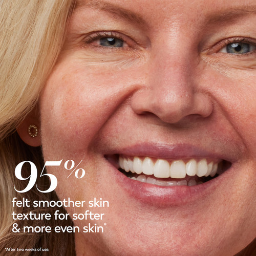 Model posing and smiling. 95% felt smoother skin texture for softer and more even skin* *after two weeks of use