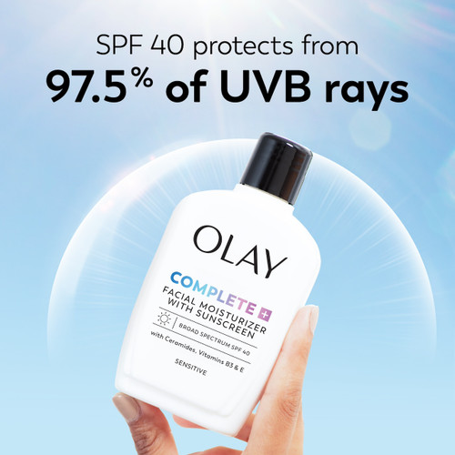 Olay Complete + Daily Facial Moisturizer with Sunscreen SPF 40 bottle in hand. SPF 40 protects from 97.5% of UVB rays