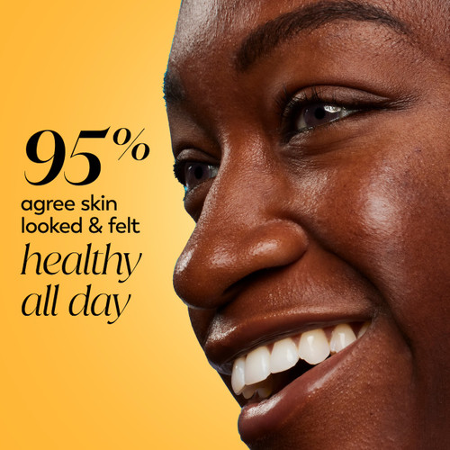 Model posing and smiling. 95% agree skin looked and felt healthy all day