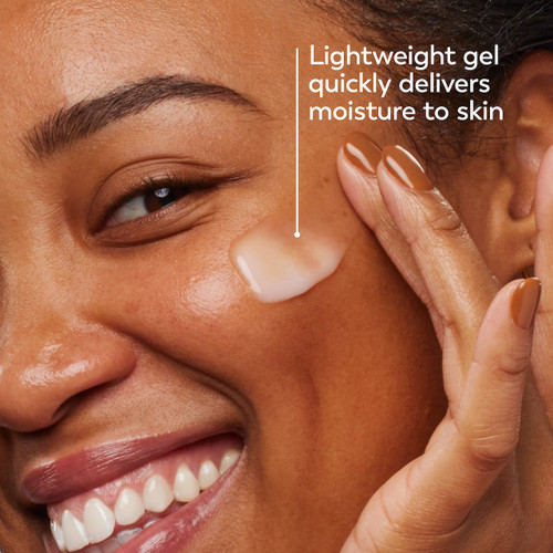 Model posing and smiling applying Olay Hyaluronic Ultralight Gel. Lightweight gel quickly delivers moisture to skin