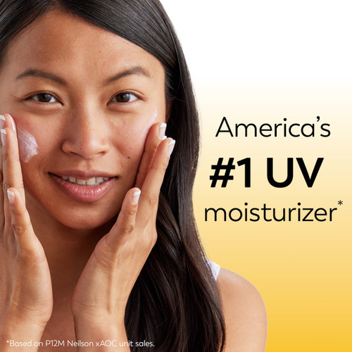 Model posing applying Olay Complete Lotion Moisturizer with SPF 15 Sensitive cream to face. America's #1 UV moisturizer* *based in P12M Neilson x AOC unit sales