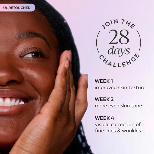 Model smiling applying Super Serum to face. Join the 28 days challenge. Week 1 improved skin texture. Week 2 more even skin tone. Week 4 visible correction of fine lines and wrinkles.