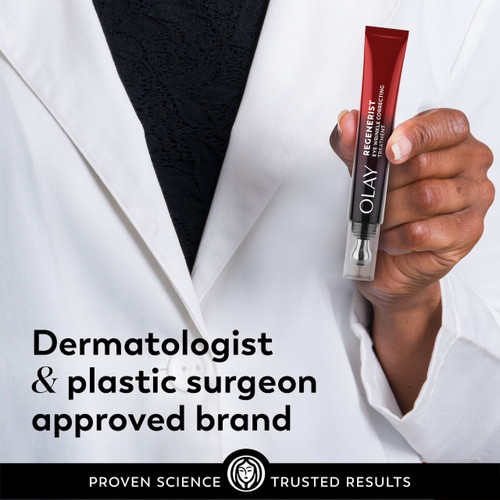 Model in lab coat holding Regenerist Eye Wrinkle Correcting Treatment applicator. Dermatologist and plastic surgeon approved brand.