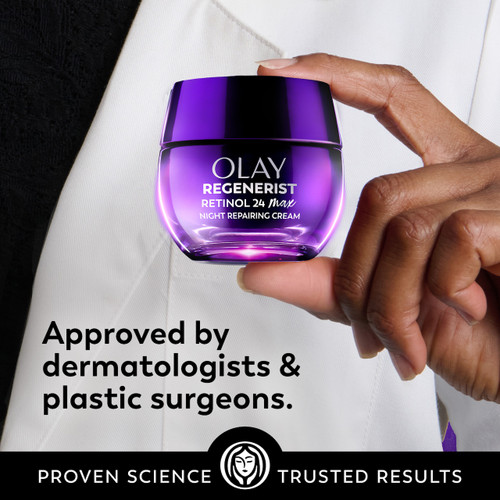 Model holding New Olay Retinol24 Max Night Moisturizer jar. Approved by dermatologists and plastic surgeons.