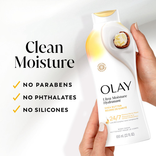 Model holding Ultra Moisture Body Wash Shea Butter bottle. Clean moisture. Parabens, phthalates, silicones.